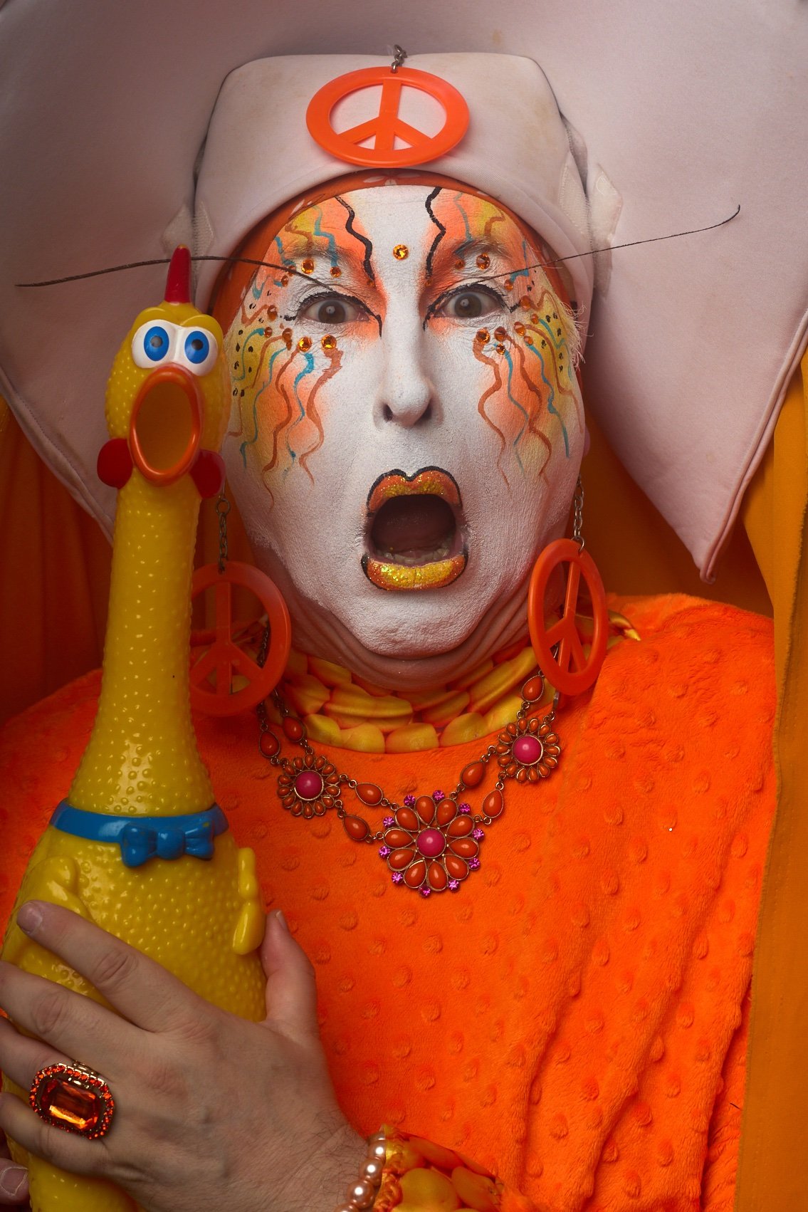 Sister Unity and a rubber chicken make matching surprised expressions